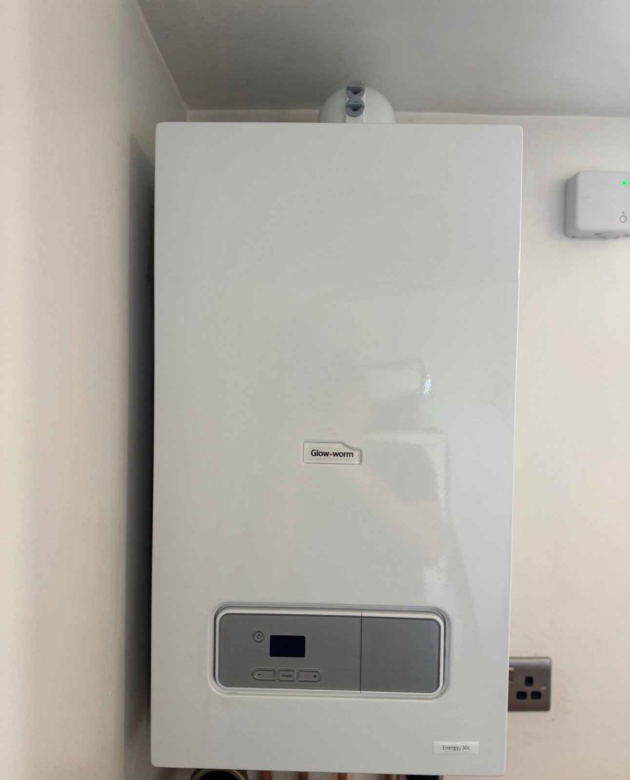 A clean, newly installed Glow-worm combi boiler fitted by JR Plumbing and Heating